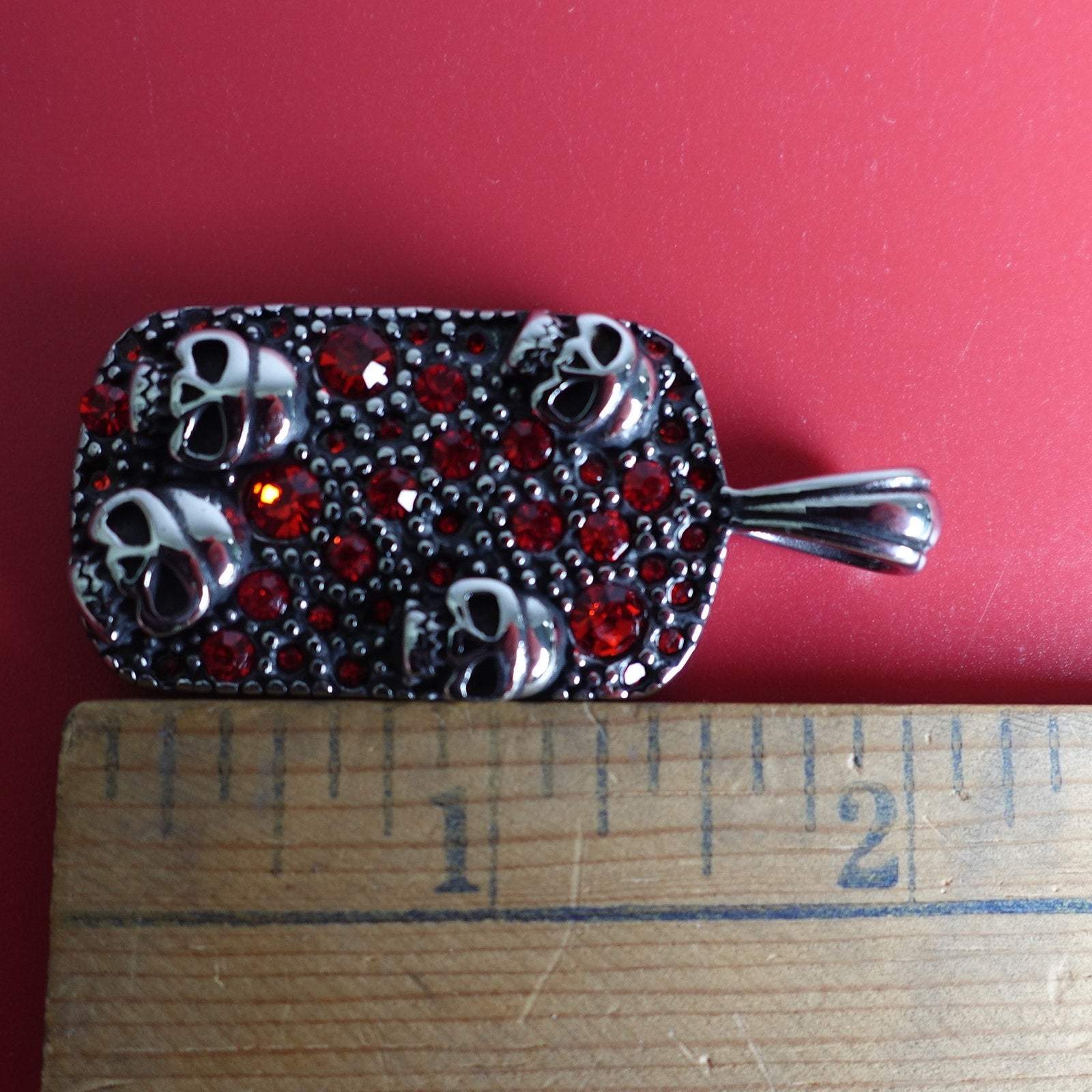 Stainless Steel Red Cubic Zirconia Encrusted Dog Tag with Skulls SP-1810