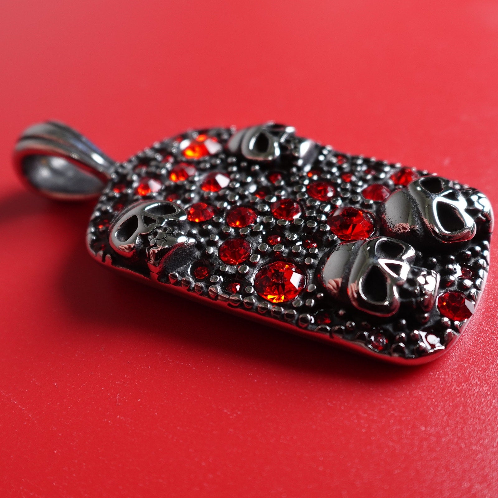 Stainless Steel Red Cubic Zirconia Encrusted Dog Tag with Skulls SP-1810