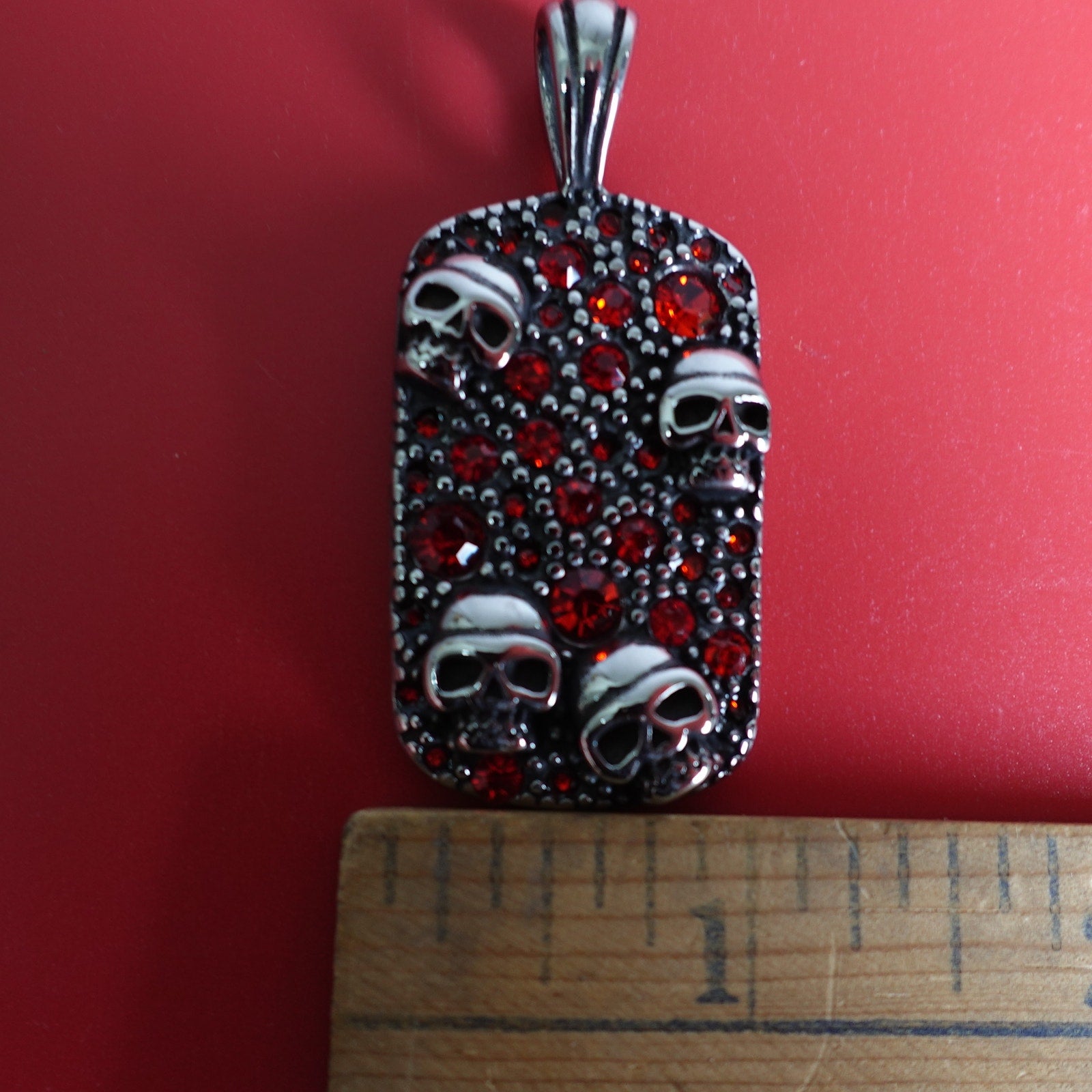 Stainless Steel Red Cubic Zirconia Encrusted Dog Tag with Skulls SP-1810